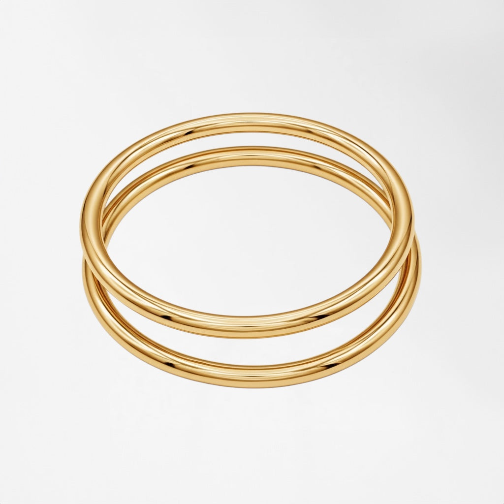 Elegant gold triple band ring made from polished metal, perfect for stacking or solo wear.