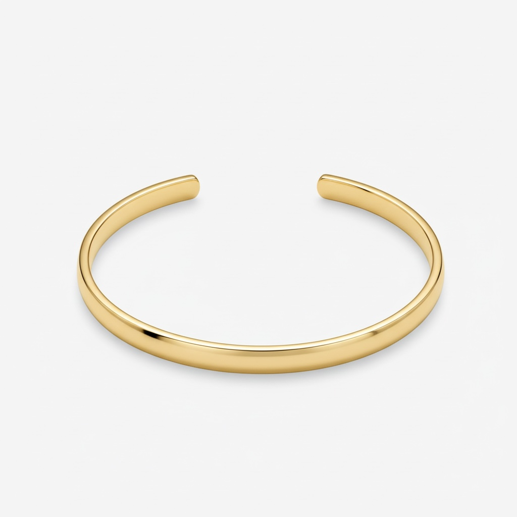 Sleek gold cuff bracelet, minimalist design, perfect for stacking or solo wear.