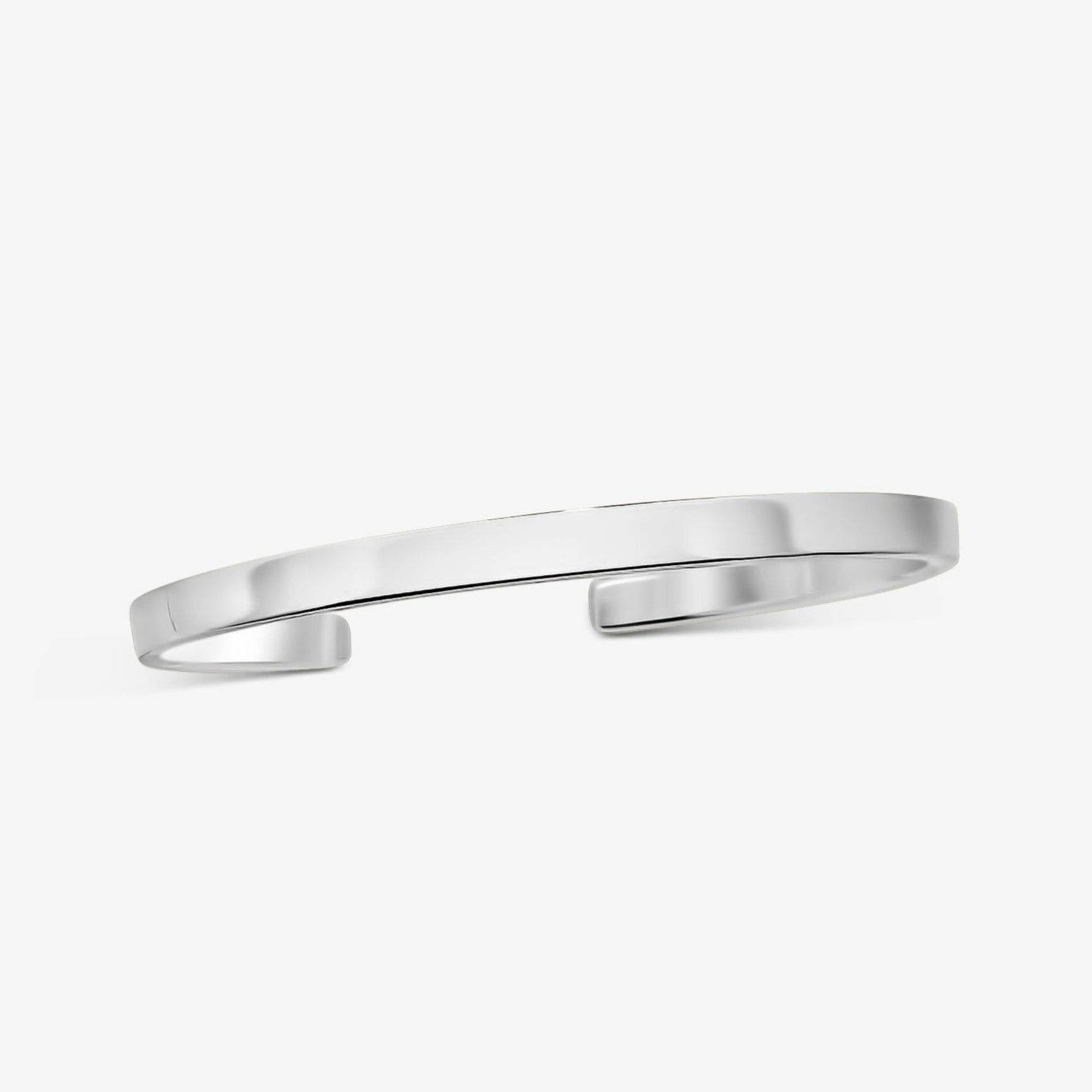 Sleek silver cuff bracelet, minimalist design, made of high-quality metal, perfect for daily wear.